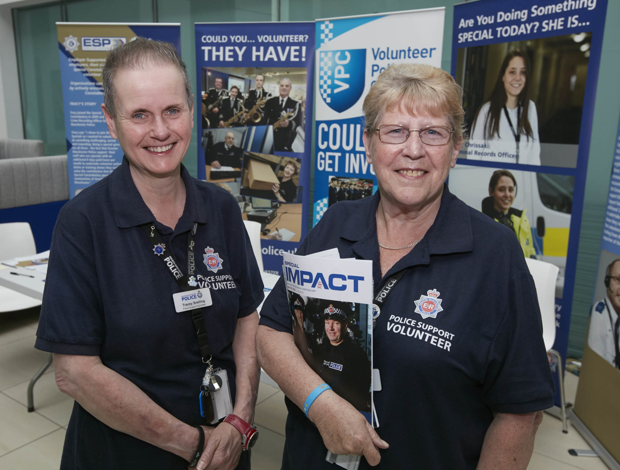 A photograph shows two police support volunteers during Greater Manchester Police's Volunteers' Week 2017