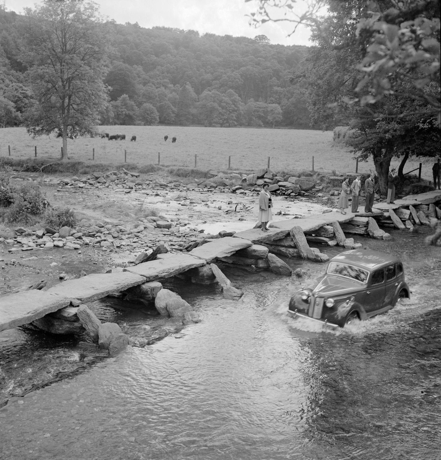 A view of the Tarr Steps stone clapper bridge over the river Barle in Somerset, which dates from the medieval period.